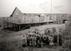 Workers at the Taniguchi fruit dryer in Sebastopol standing in front of the plant, 1920s