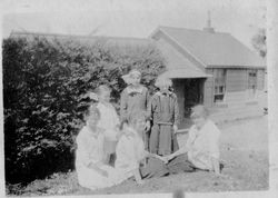 Group of four girls with two adult women, friends or relatives of the Riddell family, likely at the Riddell's Bodega Bay house, about 1915