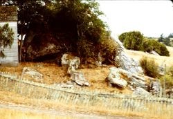 Old fence next to boulders, 1982
