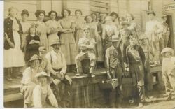 Workers at a Graton packing house (cannery) outside office, 1912