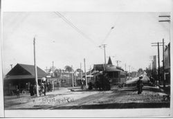Sebastopol, California P&SR depot to the left and electric car traveling north on South Main Street, about 1904