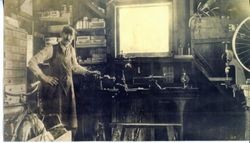 J. F. Triggs inside his bike shop at 238 South Main Street in Sebastopol, about 1917