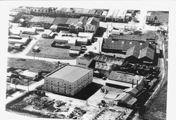 Aerial view of downtown Sebastopol with the four-story Speas Distillery building in the foreground, between 1937 and 1939