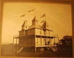 Five-steepled house on Eleanor Avenue, flying five American flags, about 1900