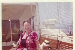 Bunni Cornelia Myers aboard a cruise ship, wearing red bandana blouse, possibly about 1960s