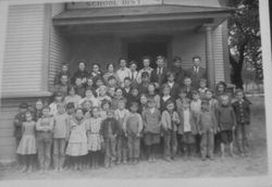 Pleasant Hill School with students and teachers on front steps of school, about 1900