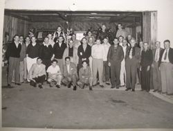 Men of the Graton Volunteer Fire Department of 1951 stand in front of the open garage with two firetrucks
