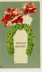 Birthday card of a horseshoe made of four-leaf clover with poppies and "Birthday Greetings" message, dated August 14, 1911