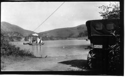 Bridgehaven ferry for cars and wagons on Russian River at the mouth of Willow Creek with tow line above, between 1916 and 1918