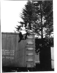 Bunni Myers and a girlfriend are seated on top of a boxcar in Rio Nido in May, 1929