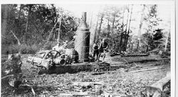 Bill Thorpe and James Thorpe logging with a Dolbeer steam donkey engine in a clearing near Thorpe's Mill 1920 near Camp Meeker and Occidental area