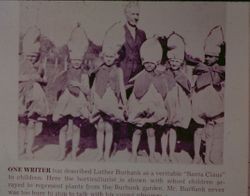 Luther Burbank with children dressed as flowers