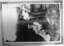 Karl Asman kneeling with Shep the dog and standing behind is Blackie, 1918