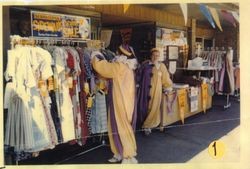 Gloria Roberts at Bea's Dress Shop at 150 North Main Street in Sebastopol, 1961 during a Sidewalk Carnival sale