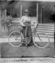 Susie (Susan) Alten, daughter of Wendell and Martha Anna Alten, standing in front of the Otis Allen residence in Santa Rosa