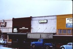 Jack's Liquor Store, Jack Clark's Mens Clothing, Apple Valley Bakery, People's Music on North Main Street in downtown Sebastopol, California, 1977