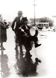 Charles Holme, Jr. (Sebastopol Cold Storage Co. manager,) pushing Art B. Sexton in a wheel barrow down Sebastopol Main Street--paying off an election bet during the Presidential election of 1940, Franklin D. Roosevelt vs Wendell Willkie