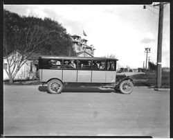 Analy Union High School bus No. 1 full of students in driveway with Analy in background, 1920s