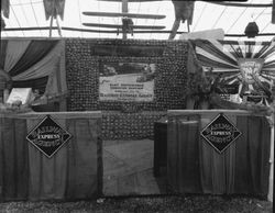 Gravenstein Apple Show, about 1930, with a display of Railway Express Agency and a sign for the National Automobile Club