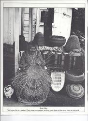 Pomo basket maker Elsie Allen weaving a Pomo basket and surrounded by a variety of the hand-woven baskets