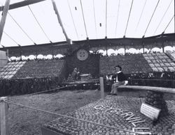 Gravenstein Apple Show, about 1930, with a display by Geyserville with a boy manikin on a see-saw