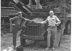 Jim Henningsen and Ralph Sturgeon, in front of their 1924 Dorris truck at Sturgeon's Sawmill, 1974