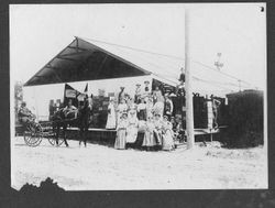 William Newton Shelley in a horse-drawn cart outside a packinghouse, about 1915