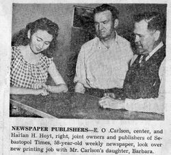 E. O. Carlson and Harlan H. Hoyt, joint owners and publishers of Sebastopol Times, look over a new printing job with Mr. Carlson's daughter, Barbara