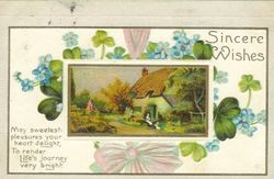 Greeting card with message, "Sincere wishes" and pictures of violets and shamrocks surrounding picture of house in country