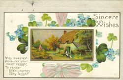 Greeting card with message, "Sincere wishes" and pictures of violets and shamrocks surrounding picture of house in country