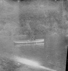 Unidentified person rowing on the Russian River, about 1900