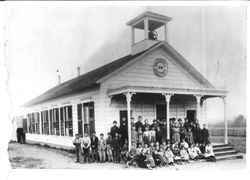 Marshall School with students and teachers on front steps in 1906