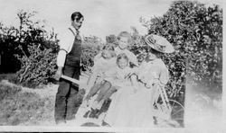 F. J. Riddell, Alice, Mrs. Eloise Riddell, daughter Blanche on her lap, and Miss Ashby, 1908