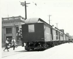 Last train of the P&SR Railway from the Forestville line to Sebastopol hauling passenger cars to Petaluma on Main Street Sebastopol, June 30, 1932