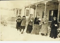 Six girls of the Strout family standing in the snow covered yard in front of houses on January 6, 1908 on Bodega Avenue