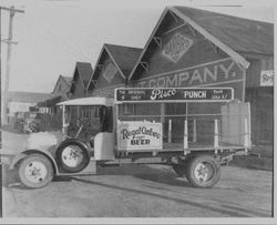 Regal Amber Lager Beer delivery truck parked next to Garbro Brand building in Sebastopol, California, 1920s