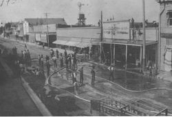 Fire at the K.O. Edgeworth & Co. Real Estate Brokers building on east side of the 100 block of Main Street Sebastopol, about 1900