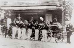 Sebastopol Volunteer Fire Department firemen standing around a horse-drawn fire wagon, July 4, 1904