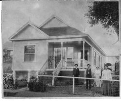 Emanuel Borba and others in front of his one story Queen Anne Cottage at 234 Pitt Avenue, built about 1905