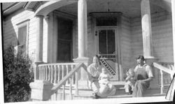 Cora Miller Elvy and husband Ludford with baby Wilma on her mother's lap and Harriet with her father, about 1918