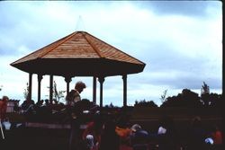 Crowd of people during the construction of the gazebo at Brookhaven Park in Sebastopol, summer 1976