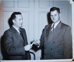 Joe Johnson handing gavel to Rueben Busse at a Sebastopol Lions Club meeting, about 1952 (Sebastopol Lions Club scrapbook photo)