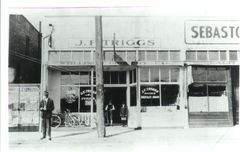 John F. Triggs standing in front of the J. F. Triggs cyclery and repair shop in Sebastopol in 1916