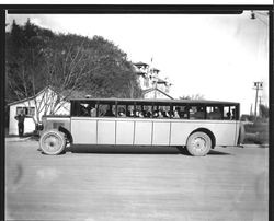 Analy Union High School bus No. 5 full of students in driveway with Analy in background, 1920s