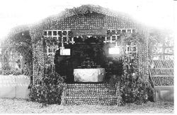1915 Gravenstein Apple Show display of a house made of apples by the Pleasant Hill Home Culture Club