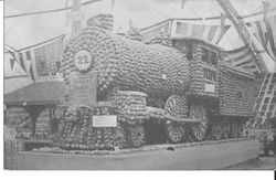 1910 Gravenstein Apple Show with an exhibit of a locomotive train engine Number 22 made of whole apples
