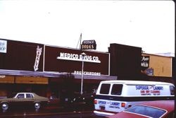 Sebastopol Book Shop, Tombe Realty, Medico Drugs and J.E. Pozzi Jeweler stores in downtown Sebastopol, California, 1977