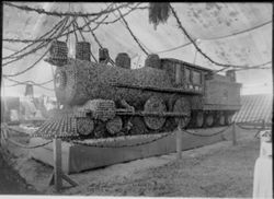 Gravenstein Apple Show exhibit 1914 in Sebastopol, showing exhibit of train made of apples with engine number "1915"