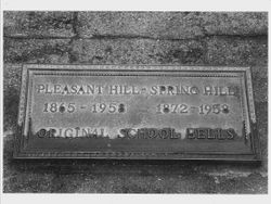 Plaque commemorating the original school bells from Pleasant Hill and Spring Hill when they were combined into Twin Hills School