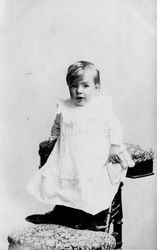 Unidentified toddler child in a studio setting